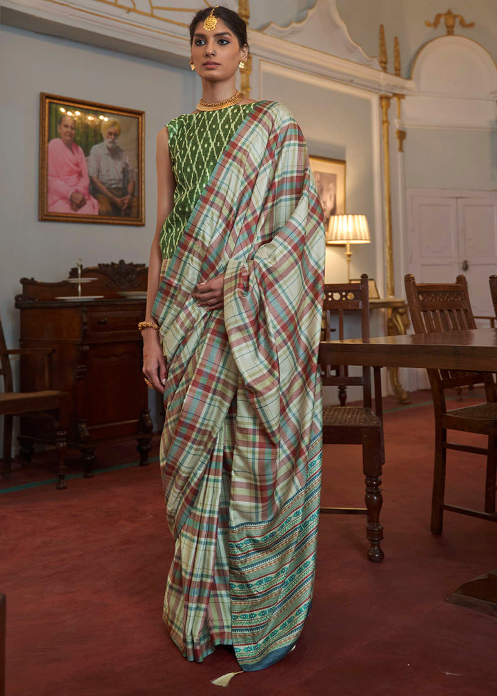 Light Blue Silk Saree Featuring Zari Weave and Green Printed Blouse