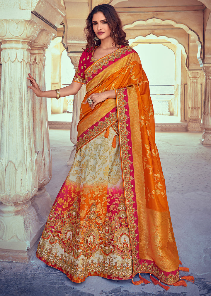 A woman wearing a traditional yellow and white banarasi silk lehenga with zari, sequins, and detailed embroidery, standing in a beautifully decorated hall.