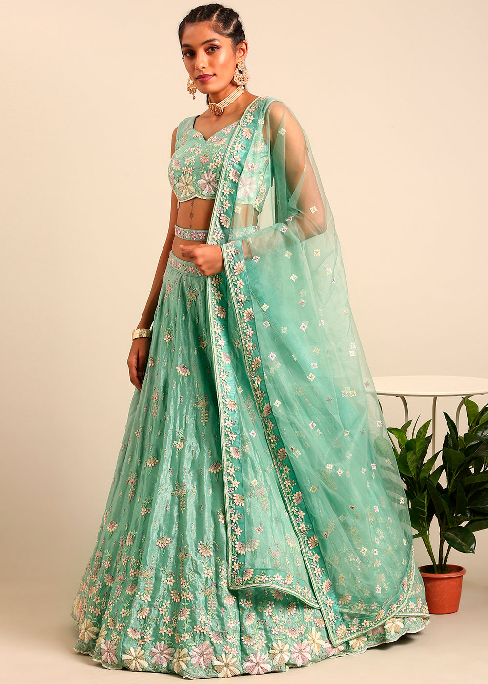 Pistachio Green Net Lehenga Choli Highlighted with heavy Sequins Embroidery