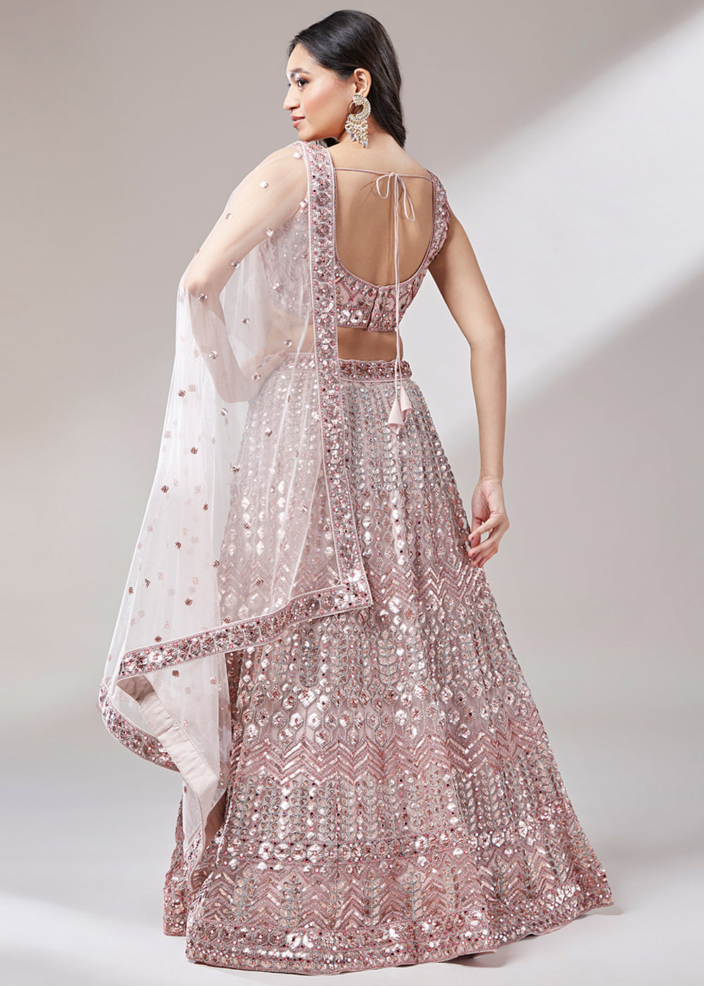 Rose Gold Pink Net Lehenga Choli Highlighted with Sequins Embroidery & Net Mirror work