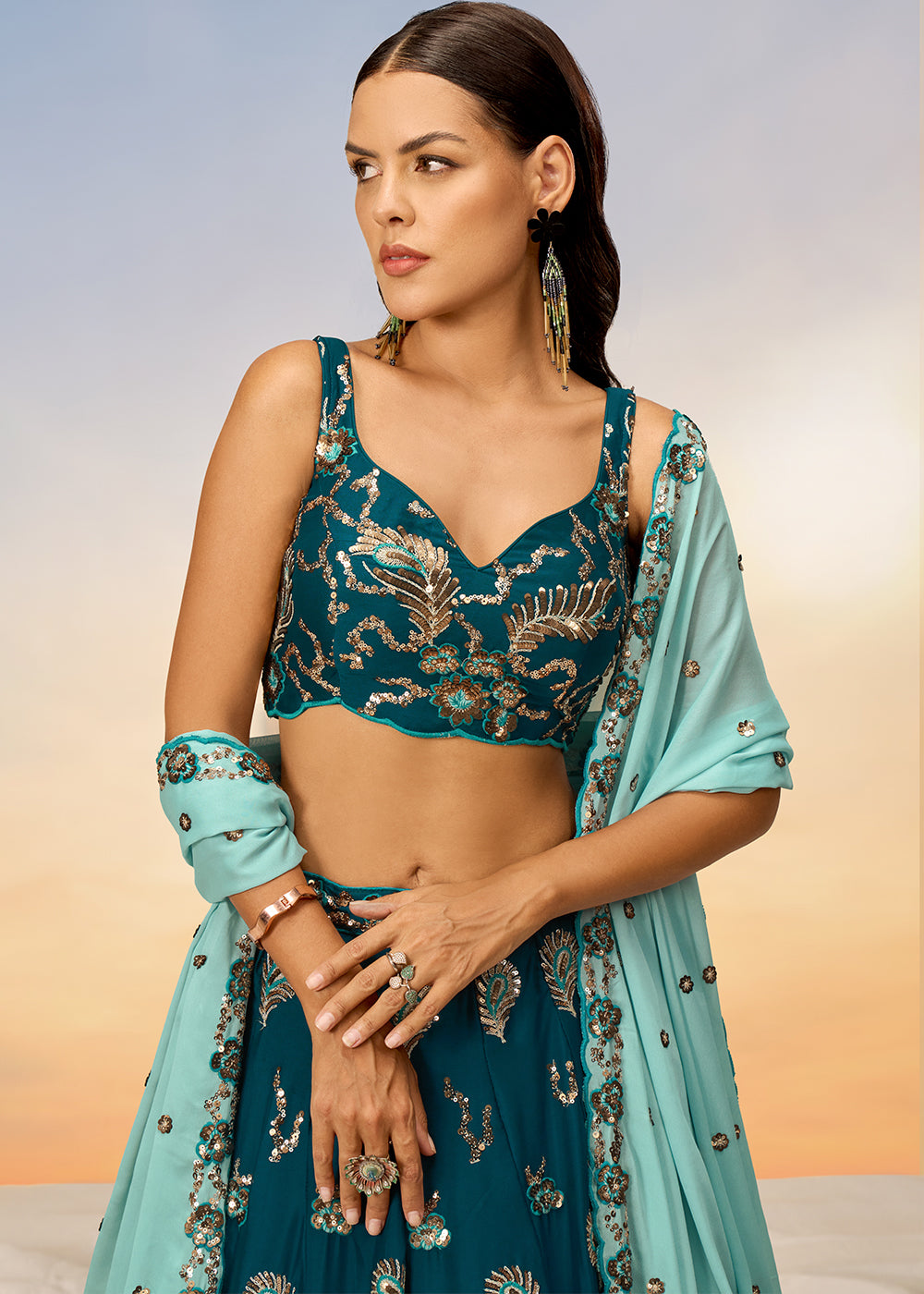 Teal Blue Georgette Lehenga Choli Adorned with Sequins Embroidery