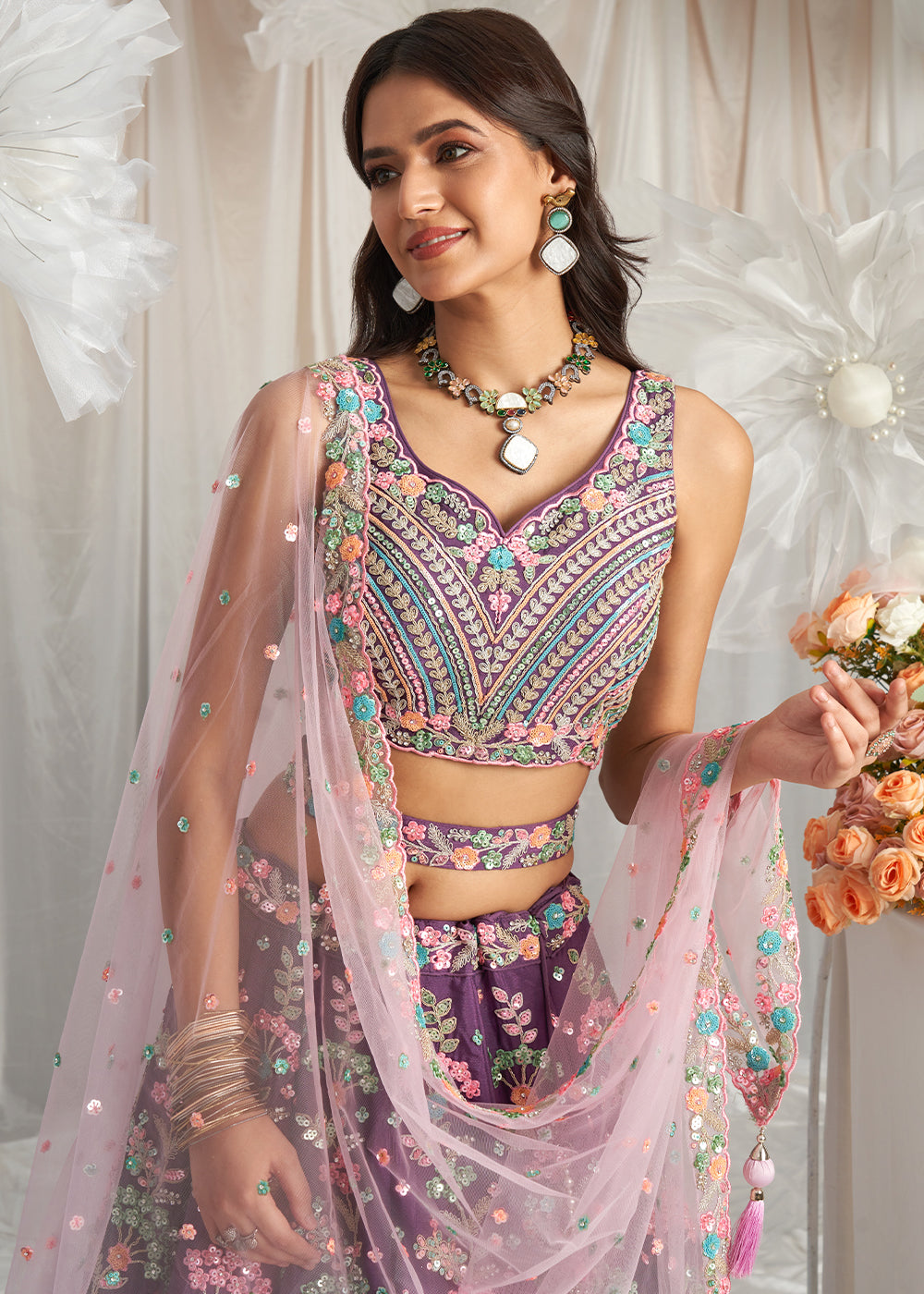 Pomegranate Purple Georgette Lehenga Choli Adorned with Sequins Embroidery