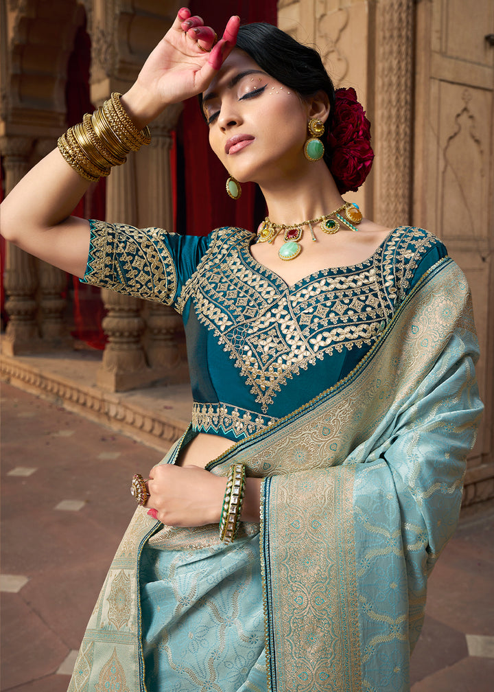 Powder Blue Saree in Satin Silk with Zari Accents and Embroidered Blouse