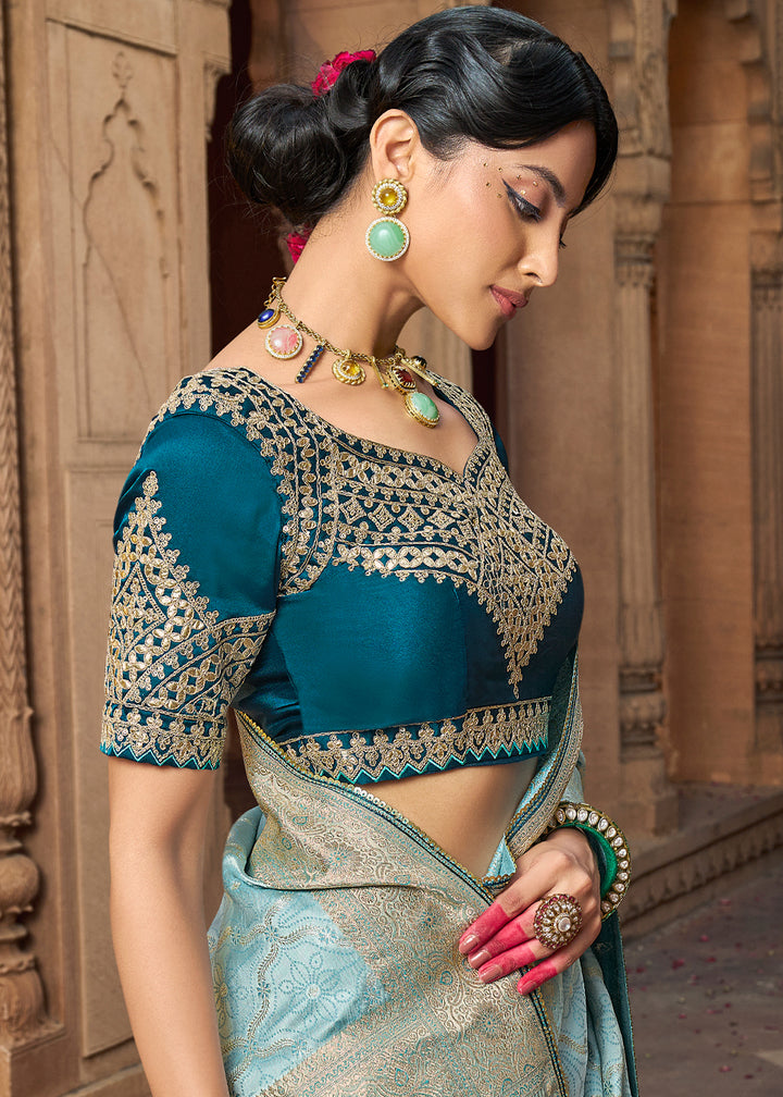 Powder Blue Saree in Satin Silk with Zari Accents and Embroidered Blouse