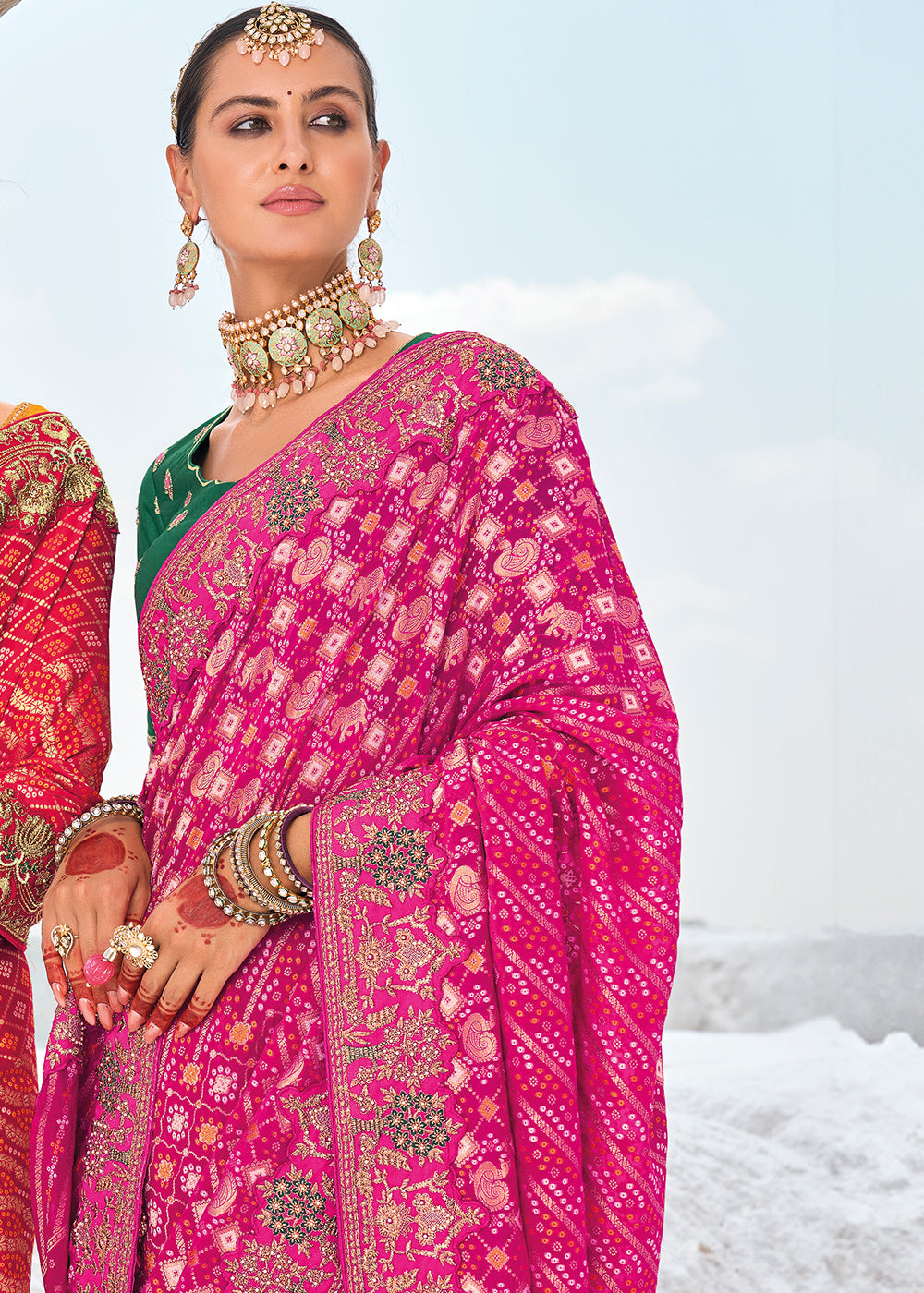 Strawberry Pink Georgette Silk Saree Featuring Zari Weave, Bandhani, and Patola Design