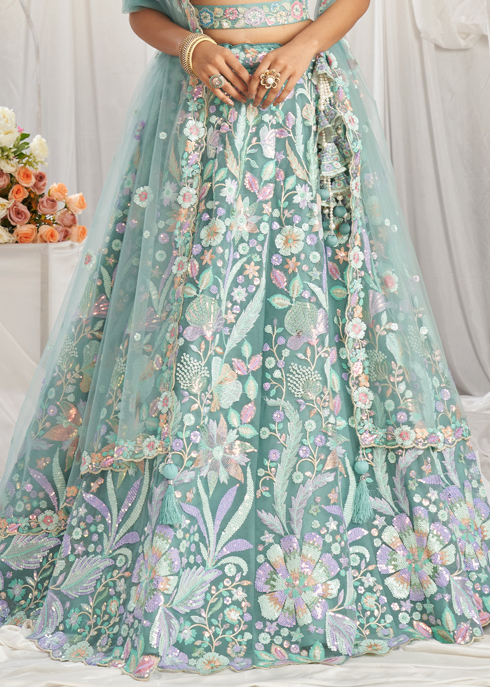 Greenish Blue Net Lehenga Choli Adorned with Sequins Embroidery Work