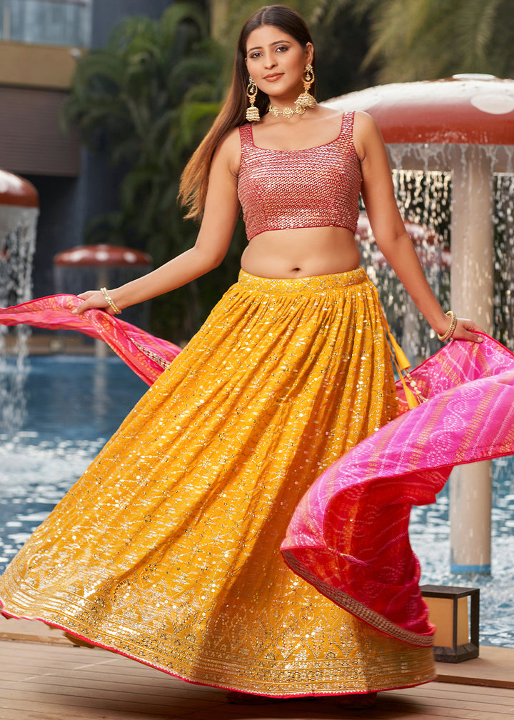 Saffron Yellow & Pink Georgette Lehenga Choli with Sequins,Zari & Thread Embroidery work