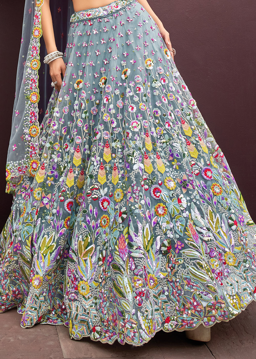 Carnation Blue Net Lehenga Choli Adorned with Cut-Dana & Handwork Embroidery: The Bride's Edit