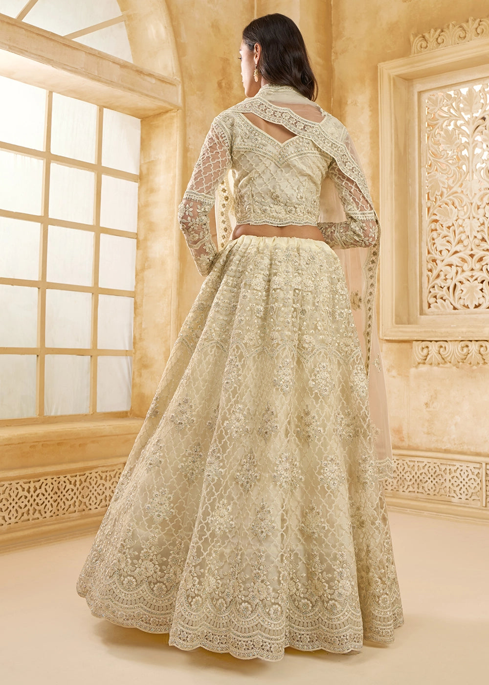 Parchment White Net Lehenga Choli with Handcrafted Cording, Thread, and Stone Work