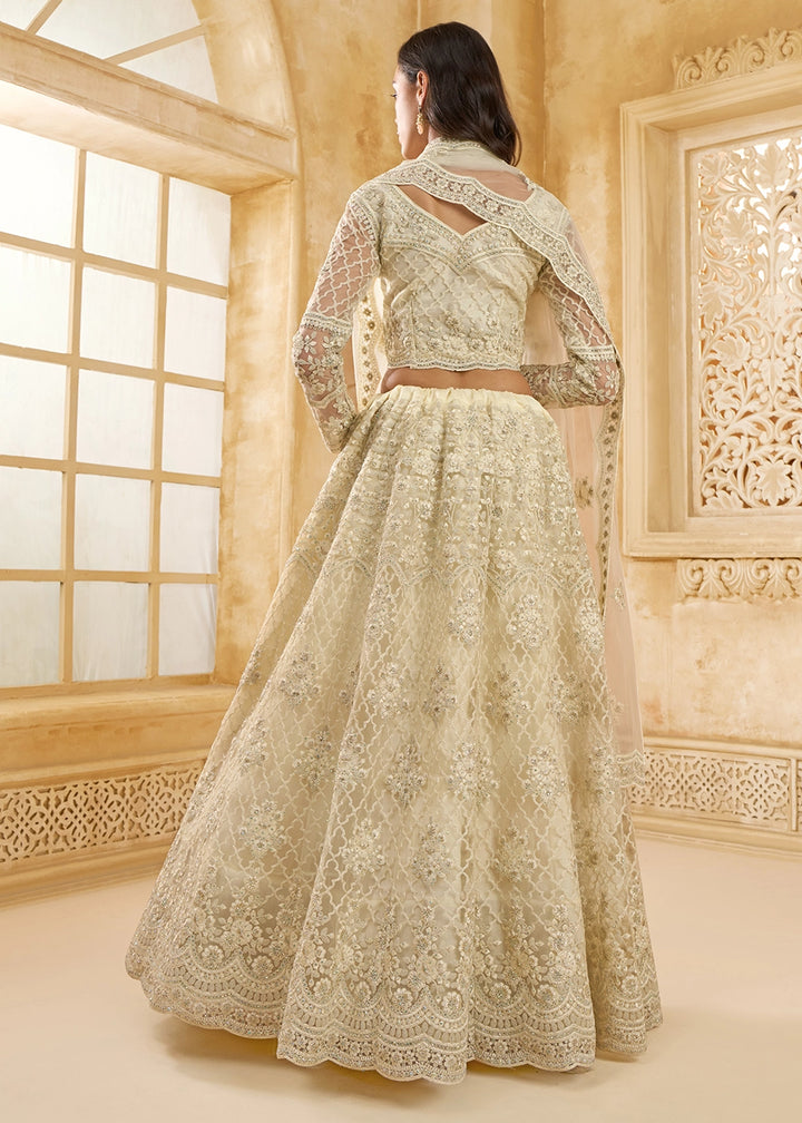 Parchment White Net Lehenga Choli with Handcrafted Cording, Thread, and Stone Work