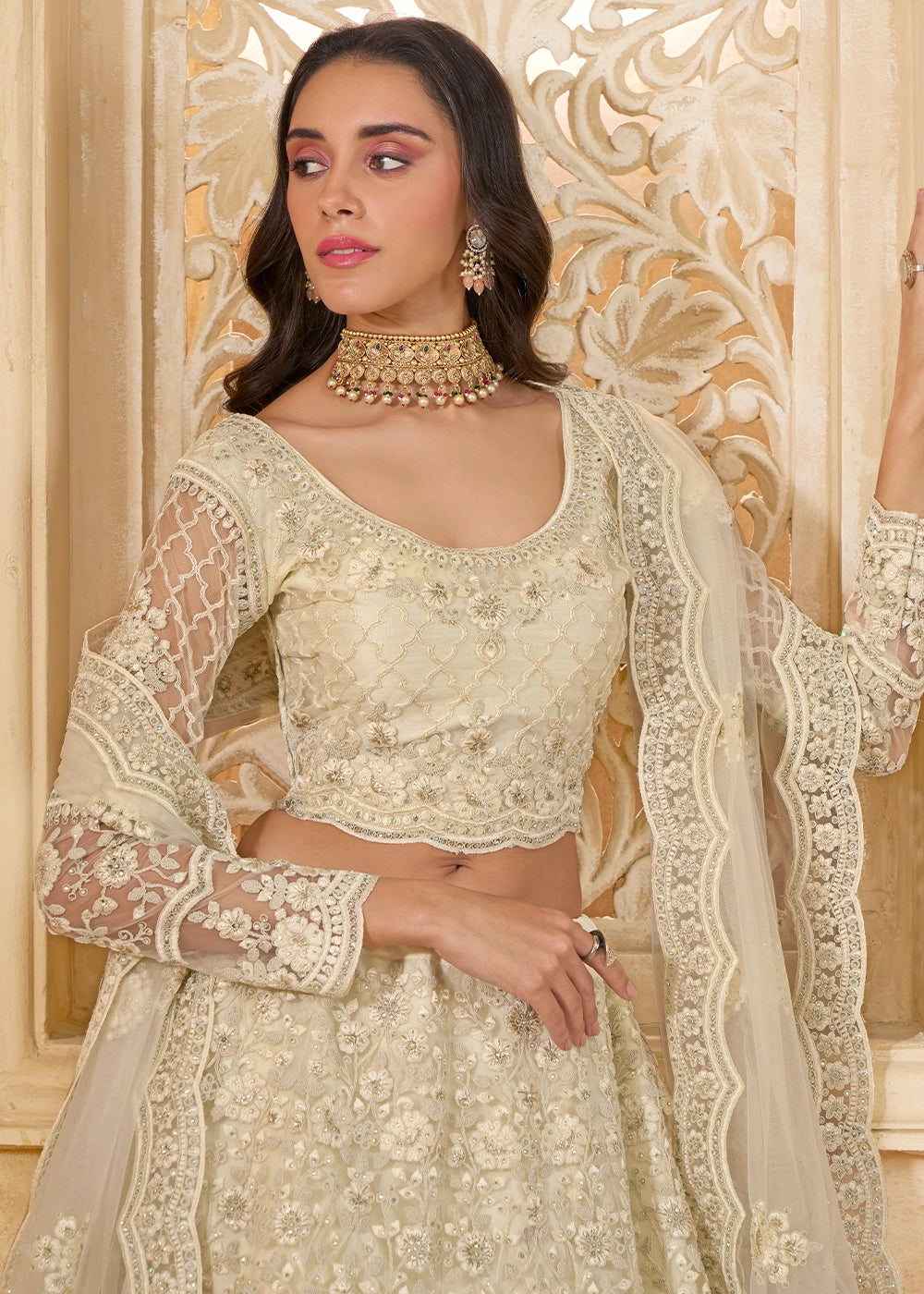 Parchment White Net Lehenga Choli with Handcrafted Cording, Thread, and Stone Work