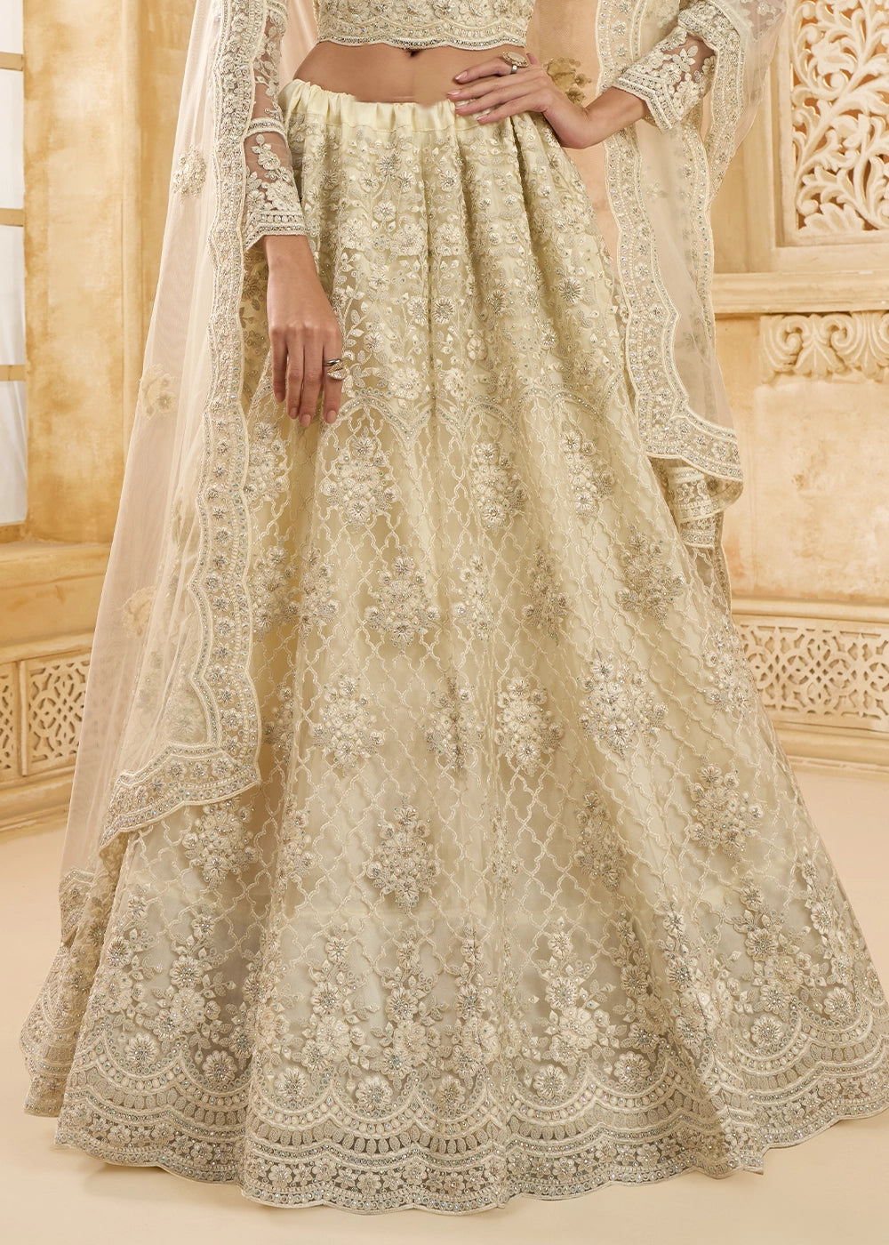 Parchment White Net Lehenga Choli with Handcrafted Cording, Thread, and Stone Work