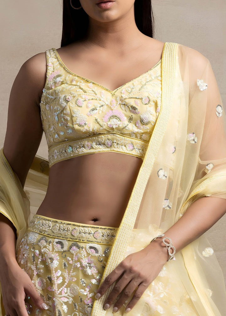 Butter Yellow Soft Net Lehenga Choli with Floral Sequin and Thread Embroidery