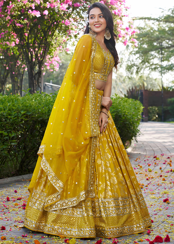 Mustard Yellow Jacquard Dola Silk Lehenga Choli with Floral Zari, Sequin &amp; Ornate Border Detailing