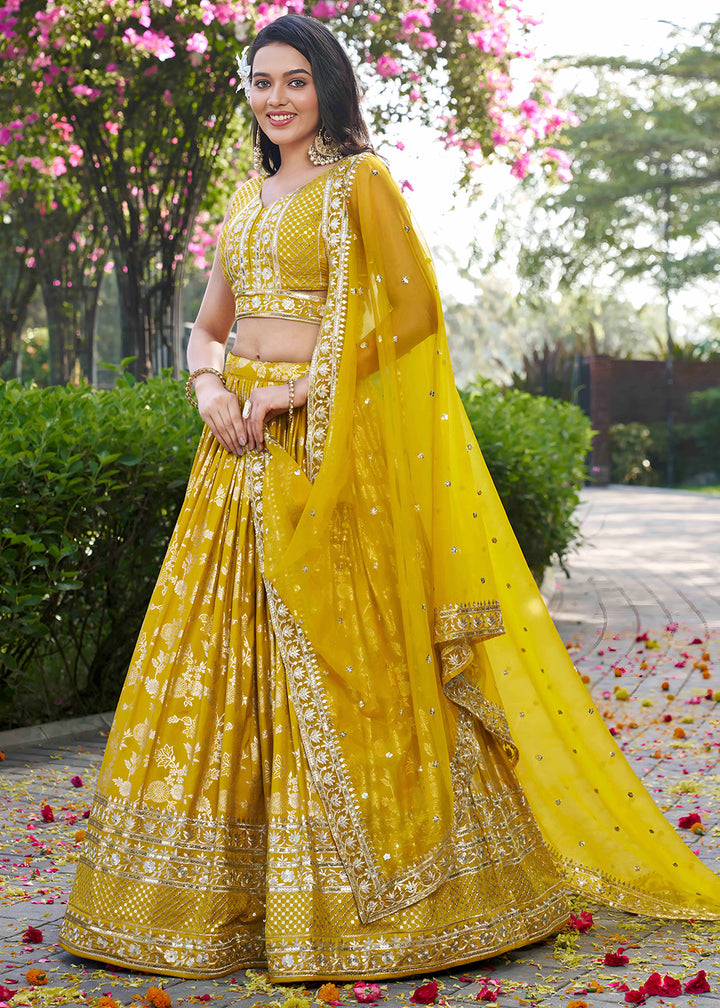 Mustard Yellow Jacquard Dola Silk Lehenga Choli with Floral Zari, Sequin &amp; Ornate Border Detailing