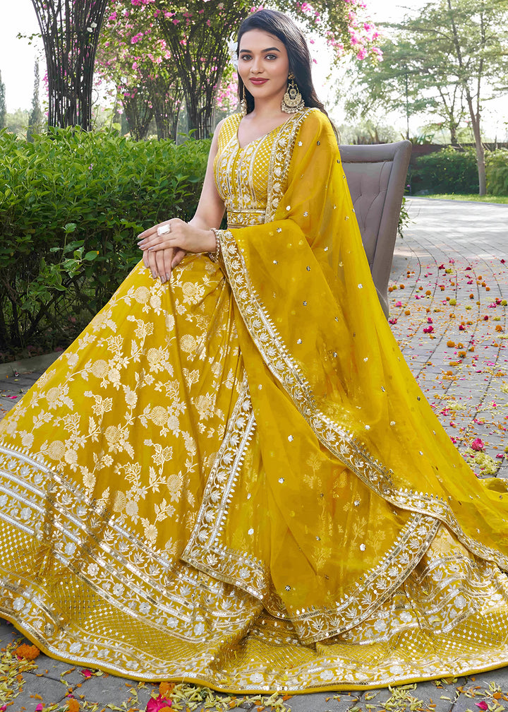 Mustard Yellow Jacquard Dola Silk Lehenga Choli with Floral Zari, Sequin &amp; Ornate Border Detailing