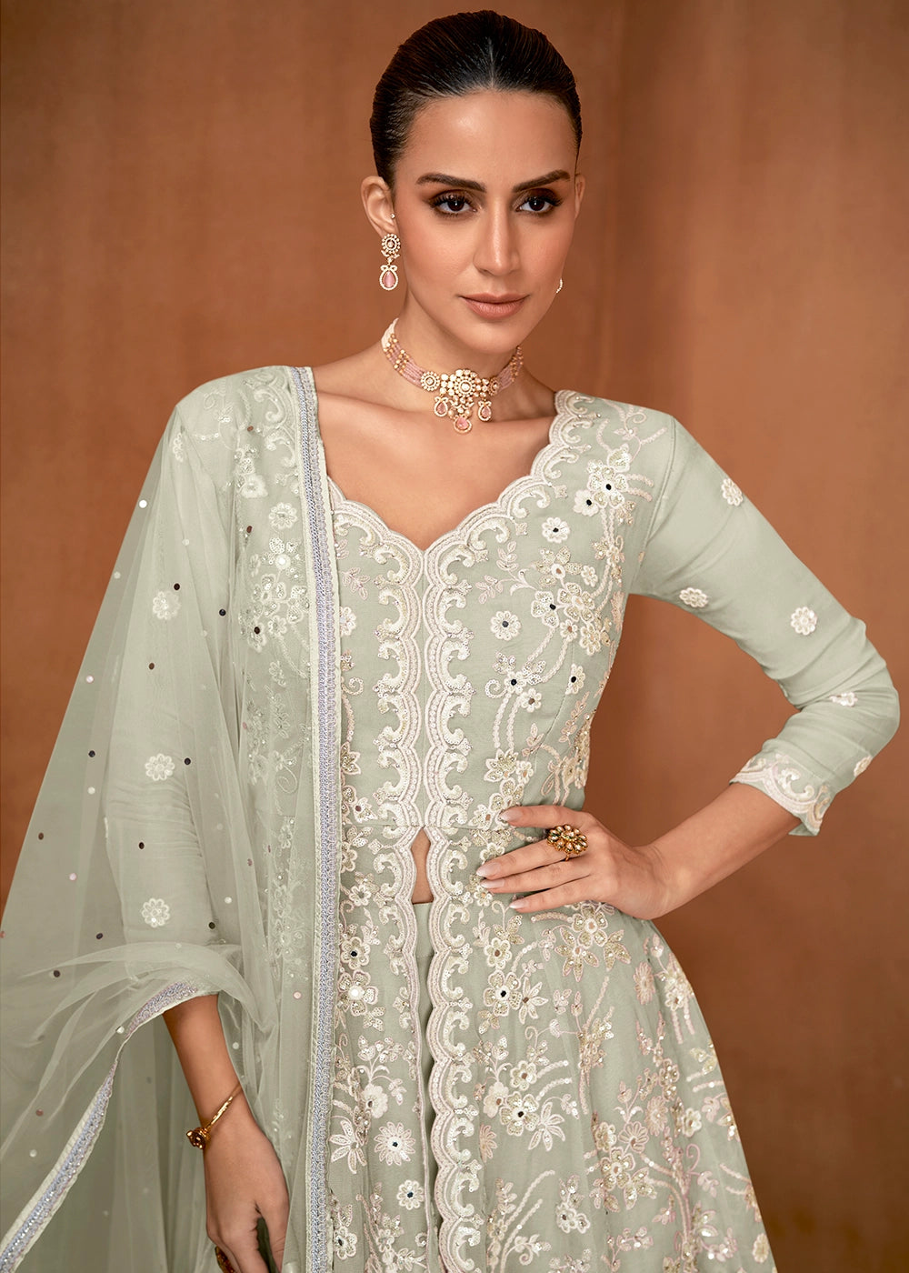 Tea Green Georgette Gharara Suit with Intricate White Thread Work