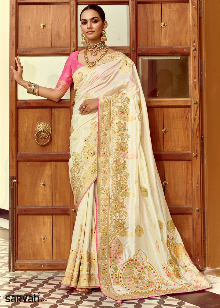 Pearl White Dola Silk Saree Featuring Zari Weave And Intricate Handwork With Cut Dana