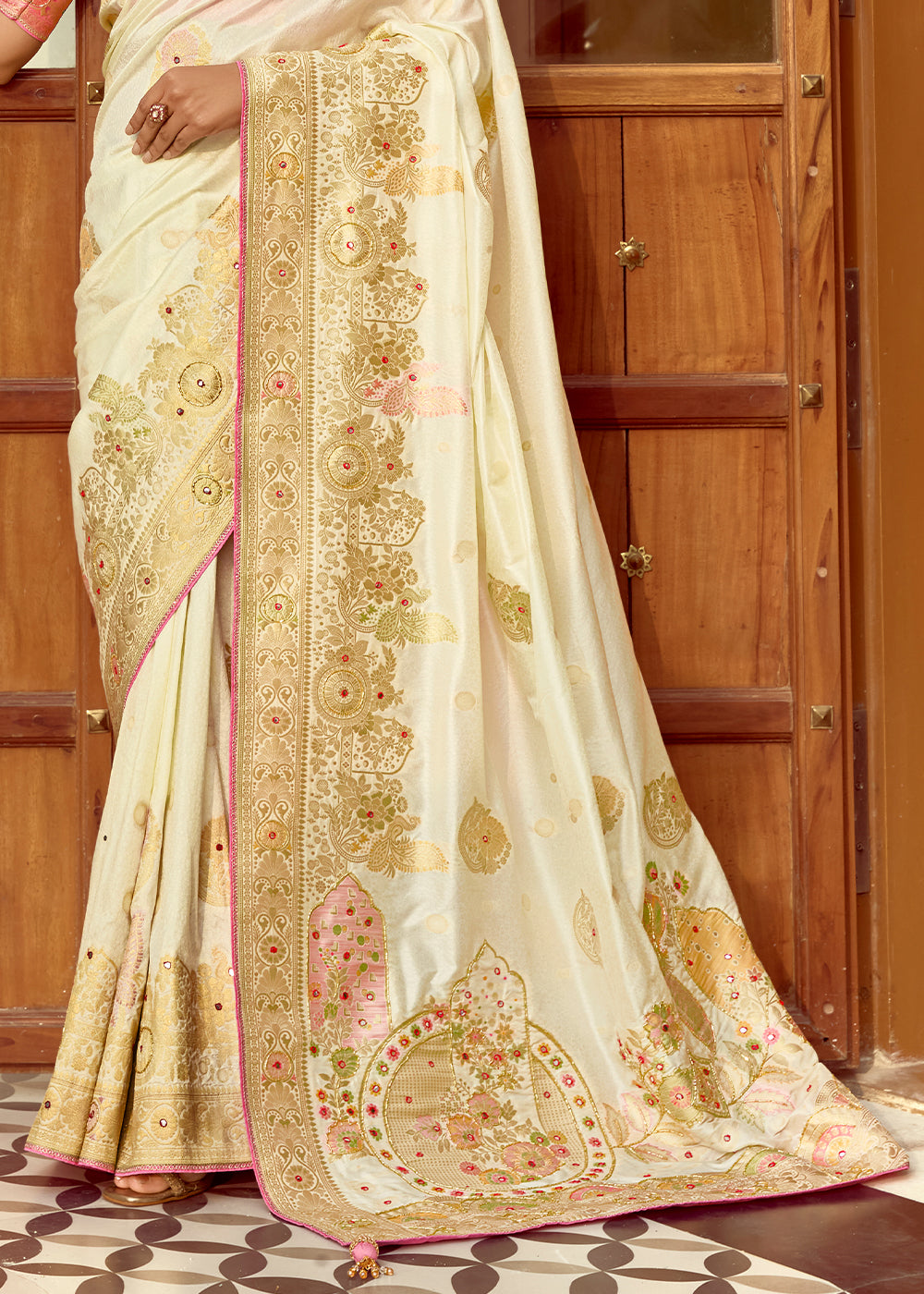 Pearl White Dola Silk Saree Featuring Zari Weave And Intricate Handwork With Cut Dana