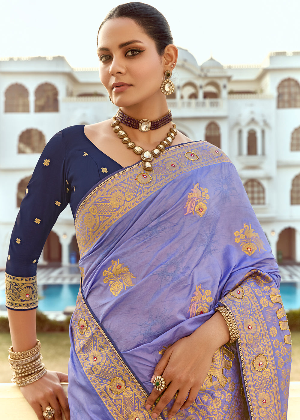 Soft Purple Dola Silk Saree Featuring Zari Weave And Intricate Handwork With Cut Dana