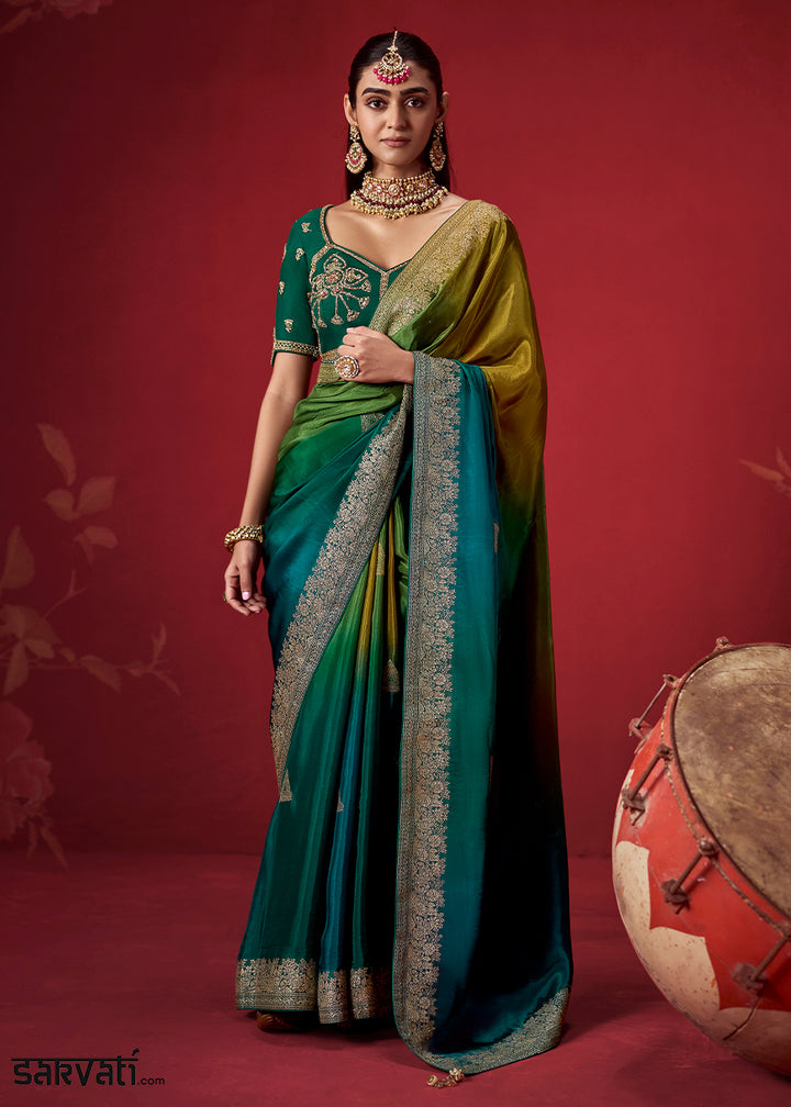 Olive Green & Peacock Blue Ombre Dola Crepe Silk Saree with Intricate Zari Border