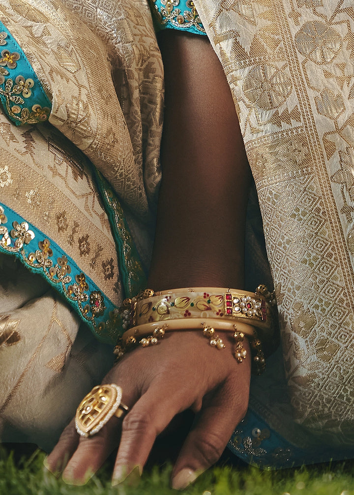 Cream White Viscose Dola Silk Saree with Handcrafted Zari & Sequin Work