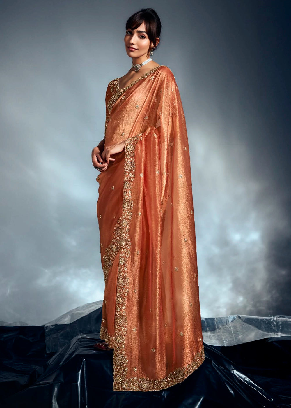 Sassy Salmon Orange Designer Saree in Tissue Fabric with Hand Embroidery