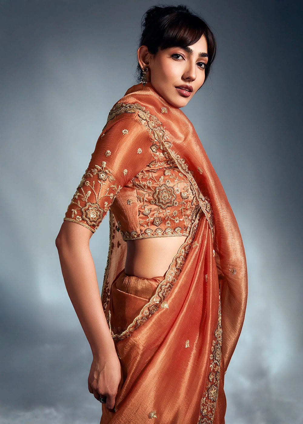 Sassy Salmon Orange Designer Saree in Tissue Fabric with Hand Embroidery
