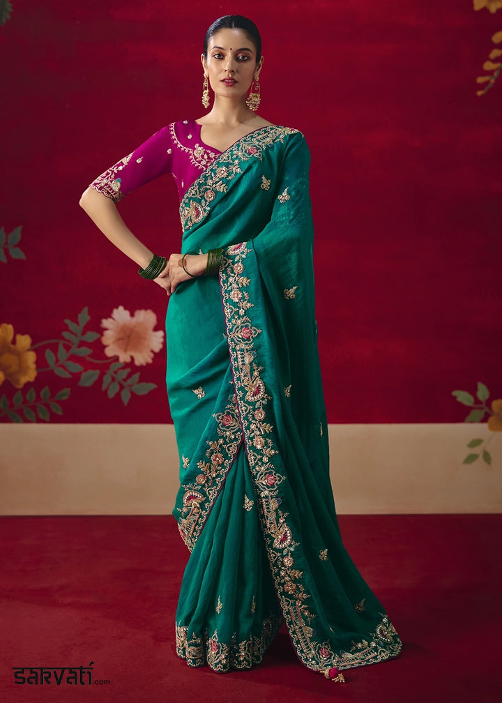 Teal Blue Tissue Silk Saree adorned with Sequins and Thread Embroidery