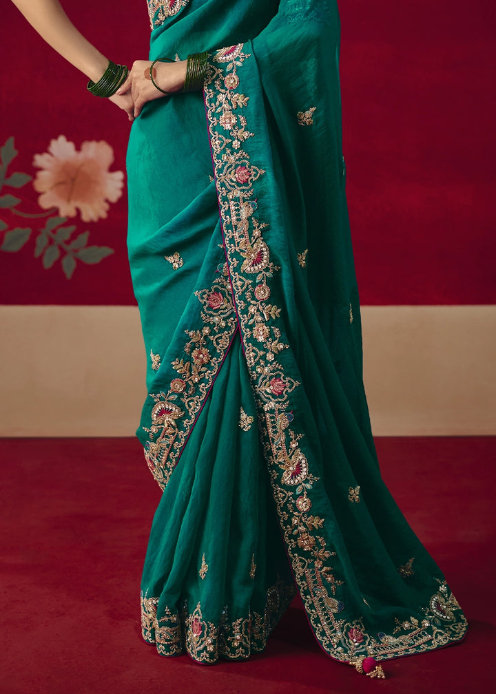 Teal Blue Tissue Silk Saree adorned with Sequins and Thread Embroidery