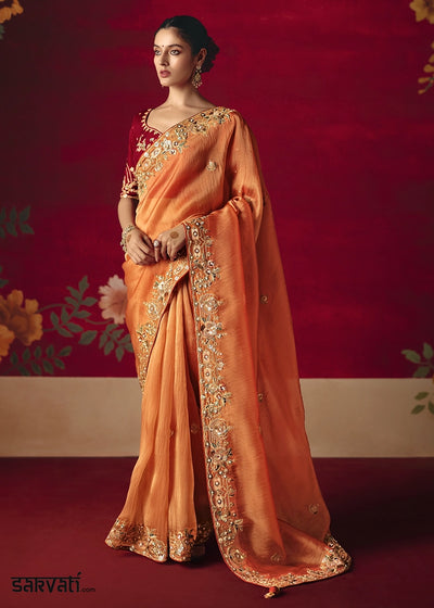 Papaya Orange Tissue Silk Saree adorned with Sequins and Thread Embroidery