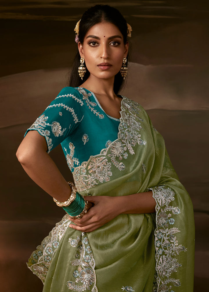 Sage Green Organza Saree Featuring Floral Zari and Sequin Embroidery