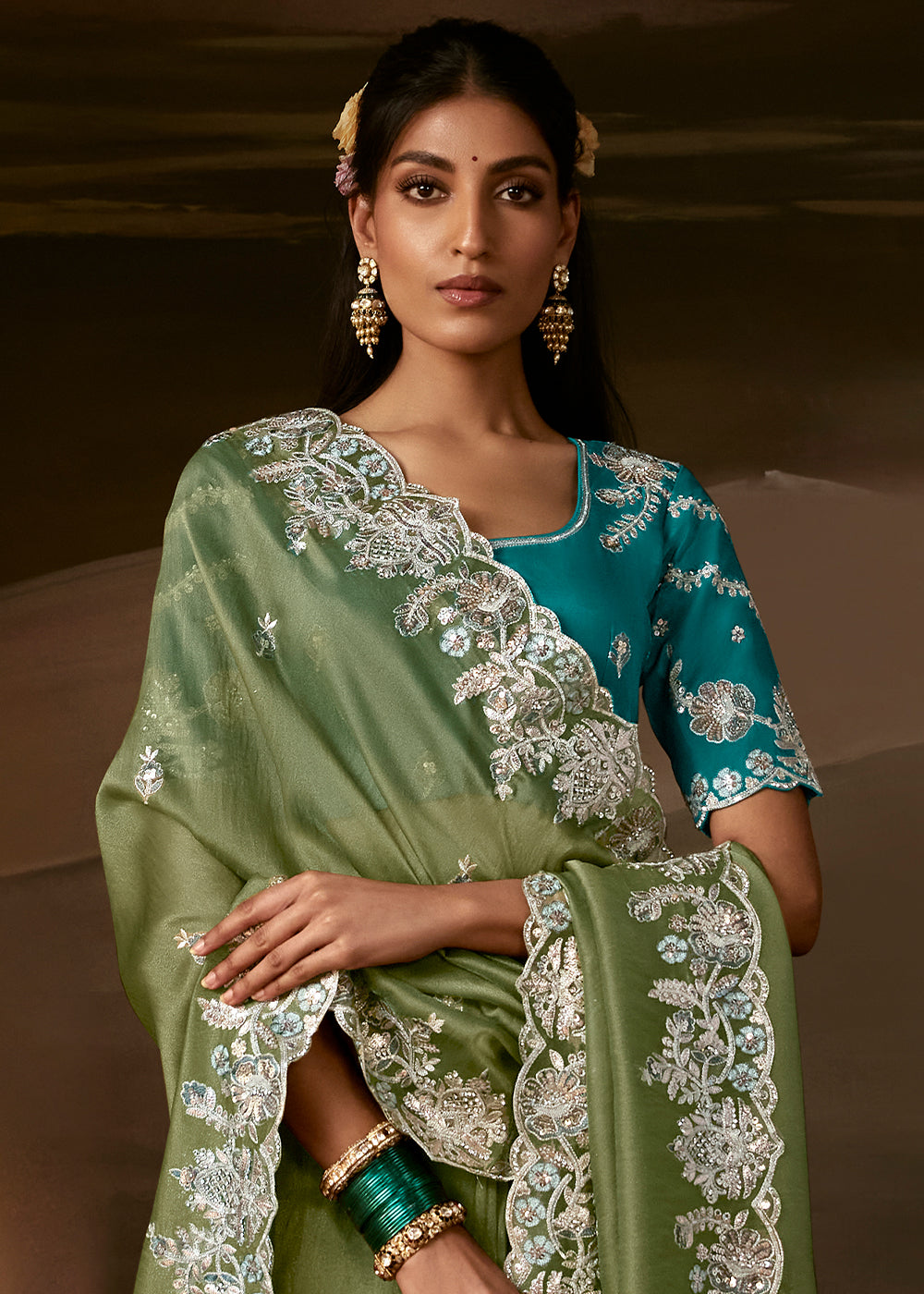 Sage Green Organza Saree Featuring Floral Zari and Sequin Embroidery