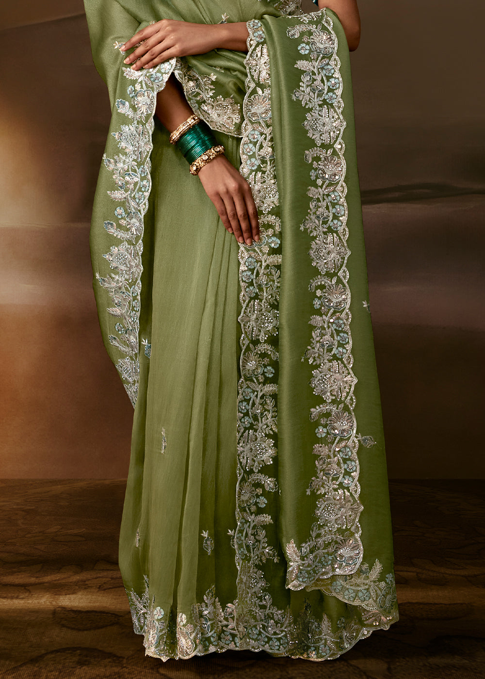 Sage Green Organza Saree Featuring Floral Zari and Sequin Embroidery