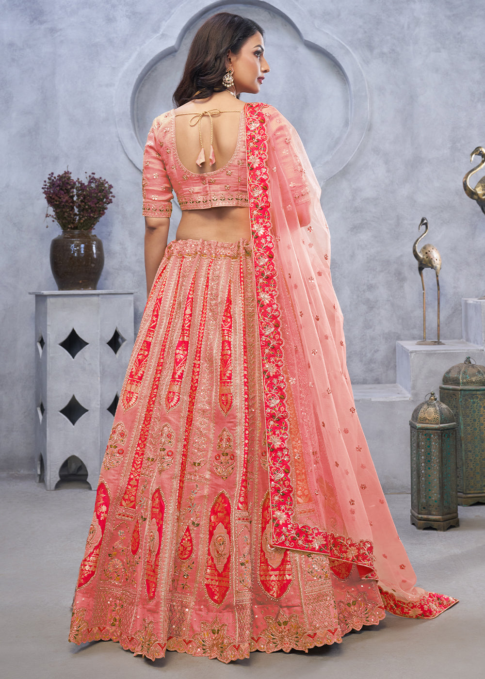 Light Peach Pink Lehenga Choli with Intricate Paisley Designs and Embroidery on Organza Silk