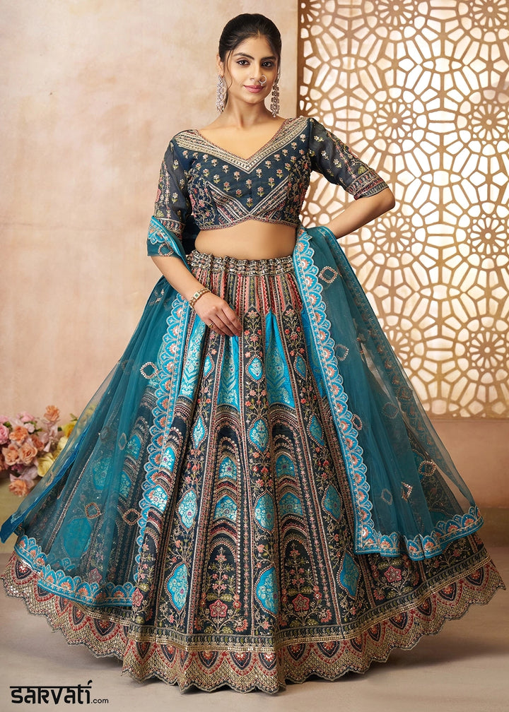 Shades Of Blue Banarasi Silk Lehenga Choli Embellished With Aari Work And Floral Detailing