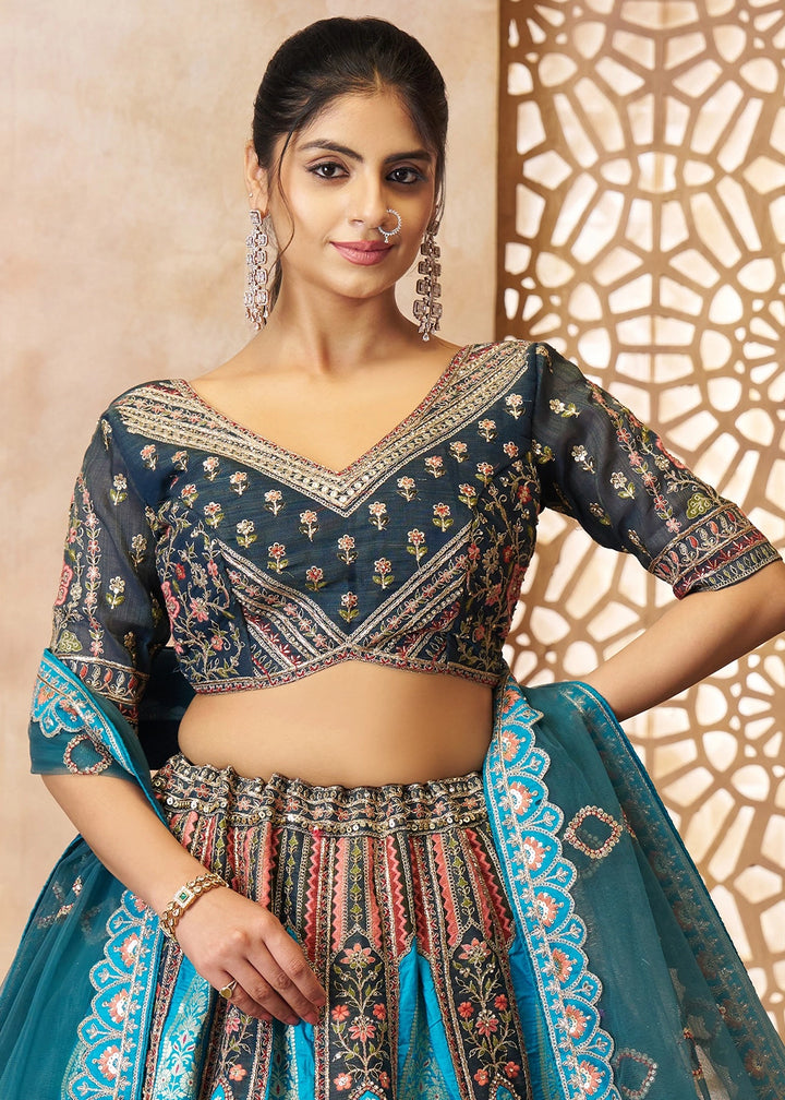 Shades Of Blue Banarasi Silk Lehenga Choli Embellished With Aari Work And Floral Detailing