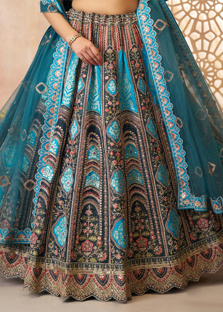 Shades Of Blue Banarasi Silk Lehenga Choli Embellished With Aari Work And Floral Detailing