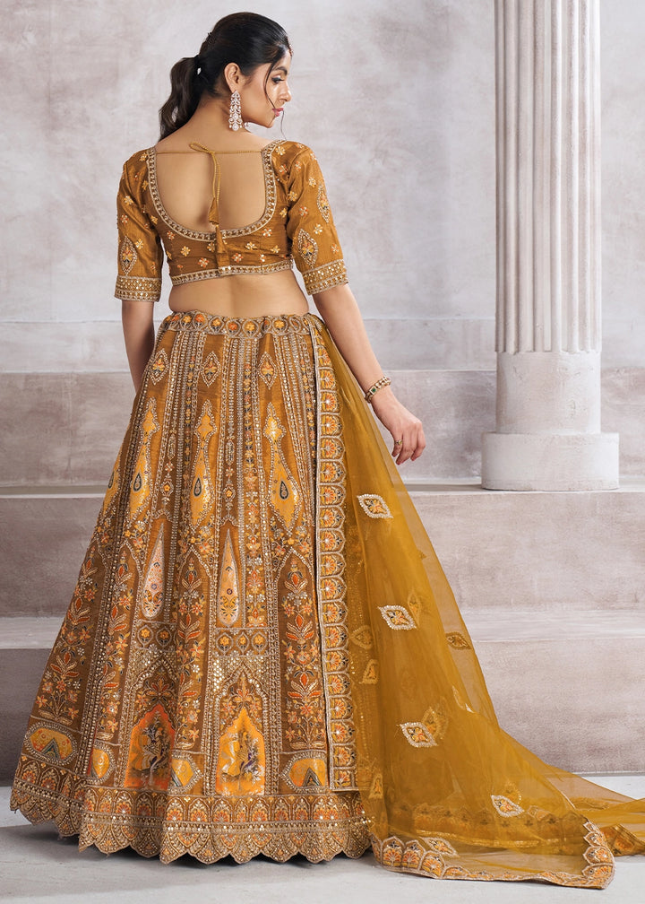 Mustard Yellow Banarasi Silk Lehenga Choli Embellished With Sequins, Aari Work And Floral Detailing