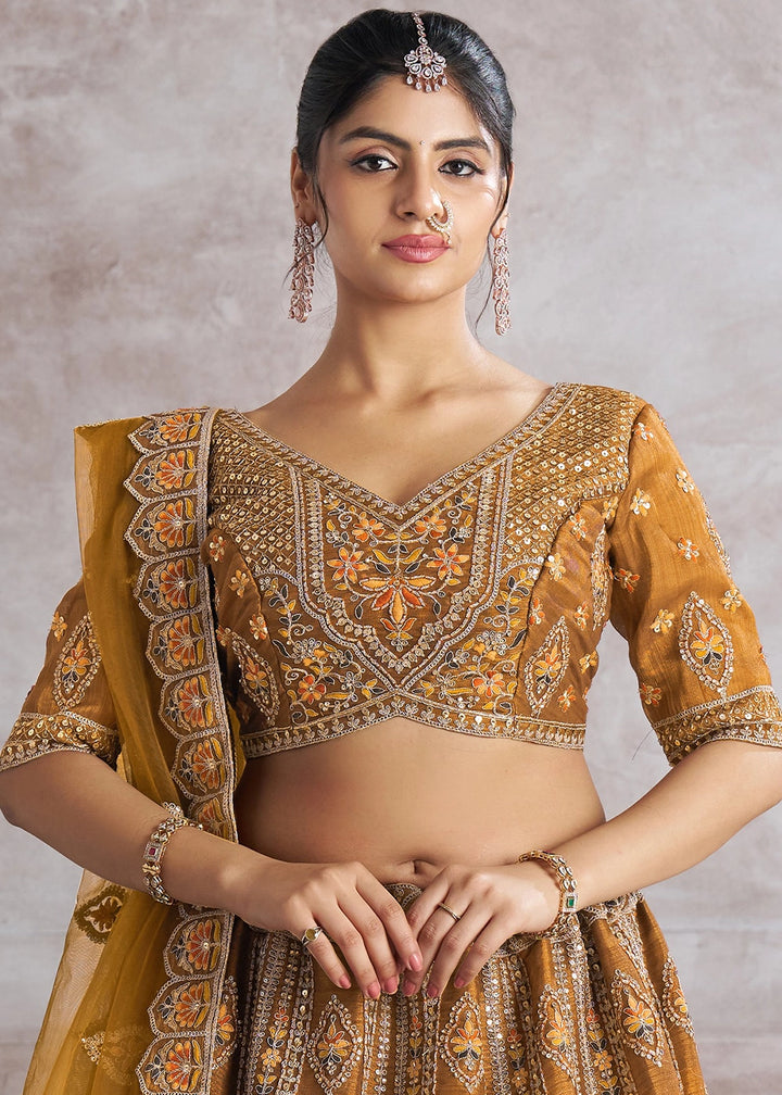 Mustard Yellow Banarasi Silk Lehenga Choli Embellished With Sequins, Aari Work And Floral Detailing