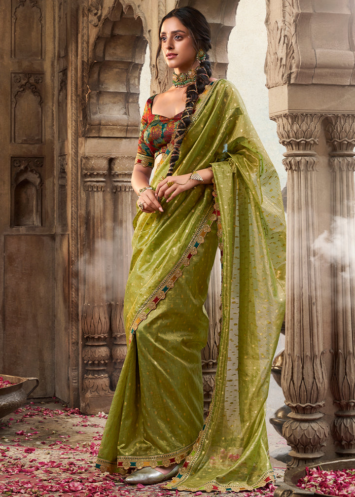 Shades Of Light Green Tissue Silk Saree Paired with Designer Blouse