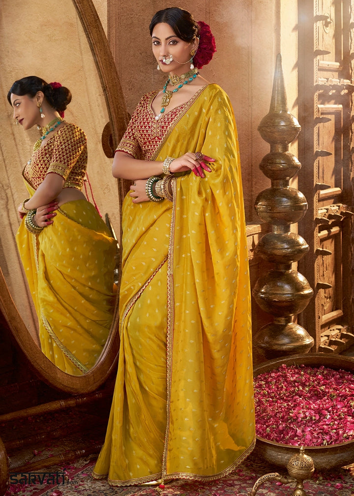 Saffron Yellow Butta Work Viscose Silk Saree Paired with Embroidered Blouse