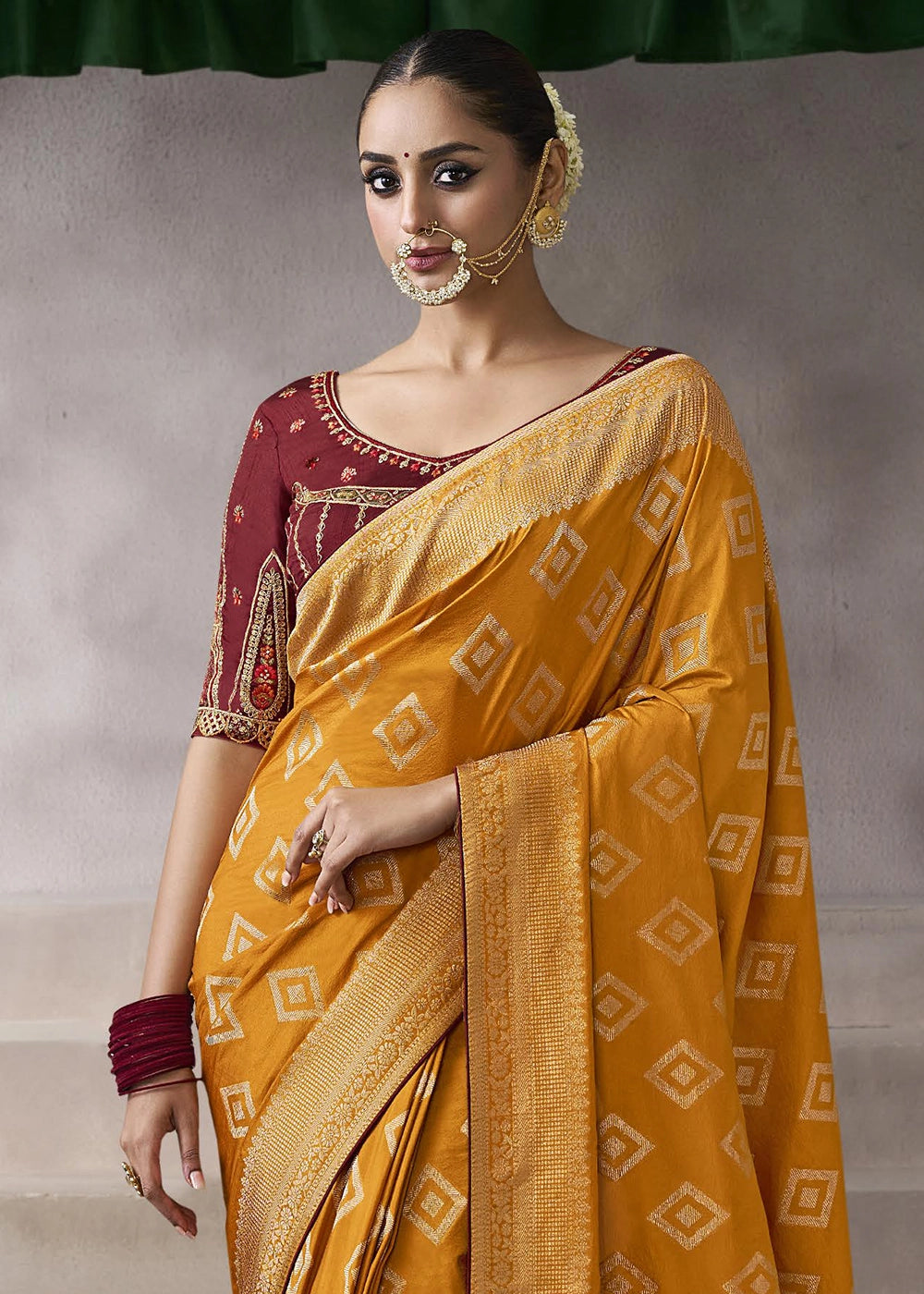 Pumpkin Orange Crepe Silk Saree with Contrast Embroidered Blouse