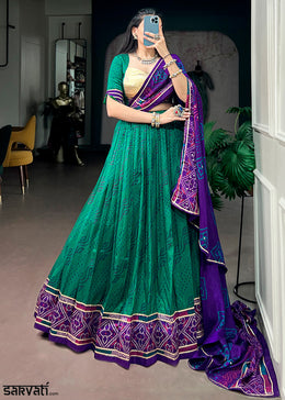 Teal Green & Purple Tussar Silk Bandhej Print Lehenga with Gota Patti Lace & Gamthi Work Blouse