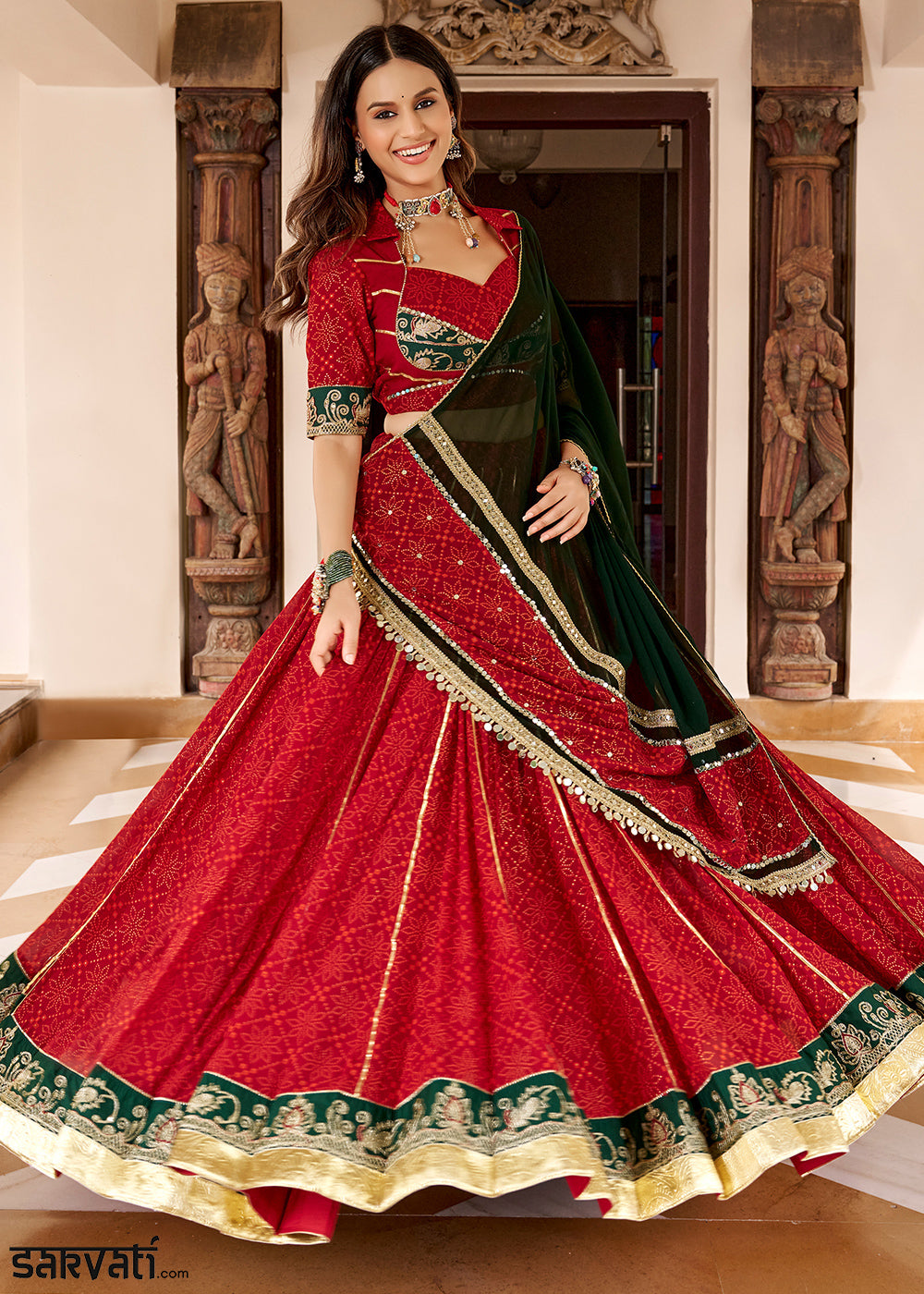 Red &amp; Green Georgette Bandhej Foil Print Navratri Lehenga Choli with Embossed Lace &amp; Gota Patti Detailing