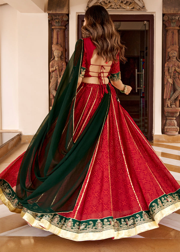 Red &amp; Green Georgette Bandhej Foil Print Navratri Lehenga Choli with Embossed Lace &amp; Gota Patti Detailing