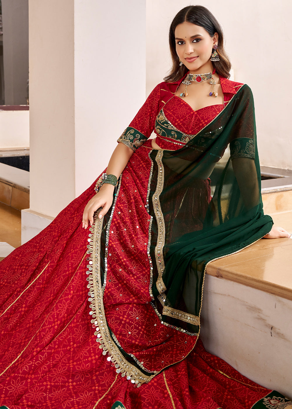 Red &amp; Green Georgette Bandhej Foil Print Navratri Lehenga Choli with Embossed Lace &amp; Gota Patti Detailing