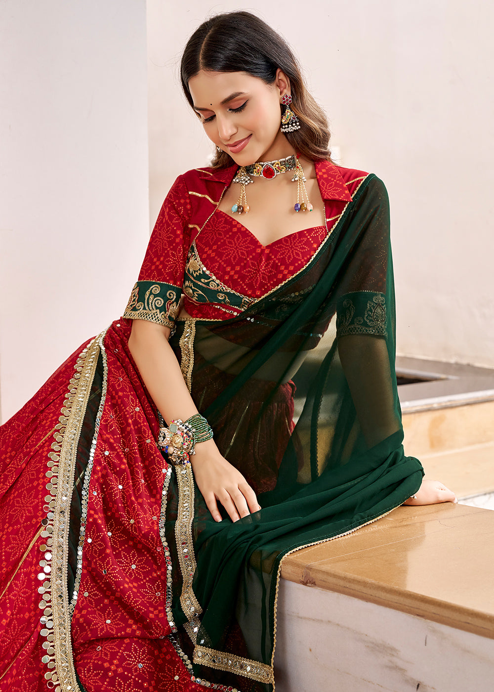 Red &amp; Green Georgette Bandhej Foil Print Navratri Lehenga Choli with Embossed Lace &amp; Gota Patti Detailing