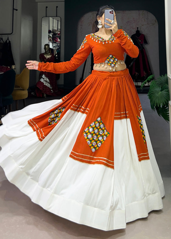 Vivid Tangerine &amp; White Rayon Navratri Lehenga Choli with Traditional Gamthi Motifs &amp; Gota Patti Accents