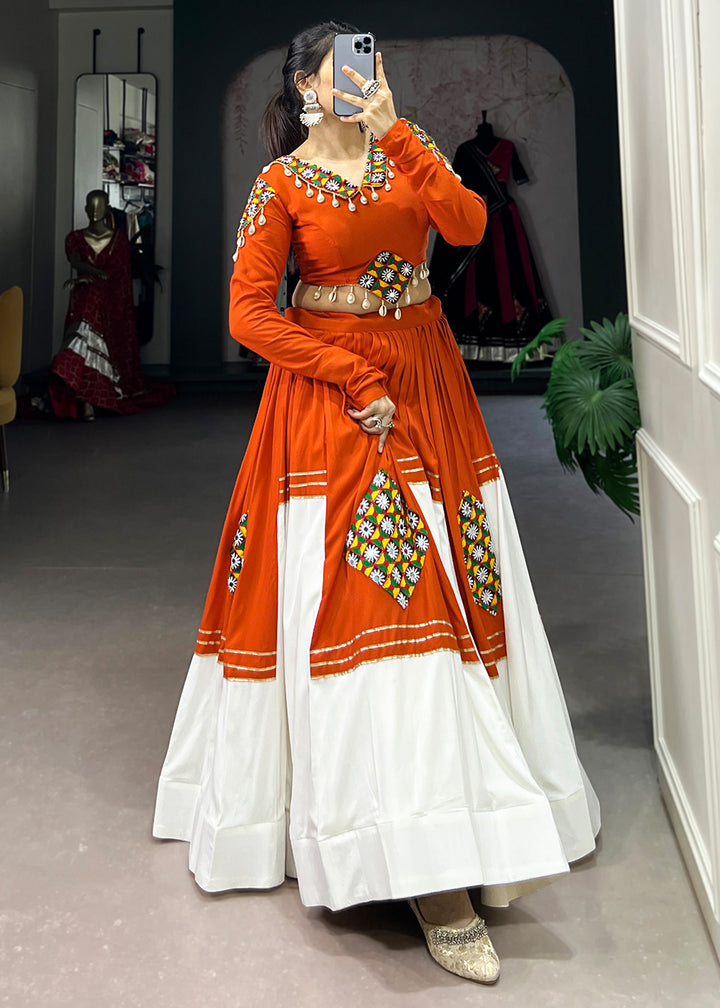 Vivid Tangerine &amp; White Rayon Navratri Lehenga Choli with Traditional Gamthi Motifs &amp; Gota Patti Accents